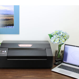 VIEW PLUS - ELITE 2 embosser / printer on a table next to a laptop